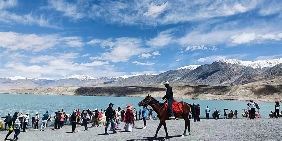 Karakuri Lake surrounded by snow mountains